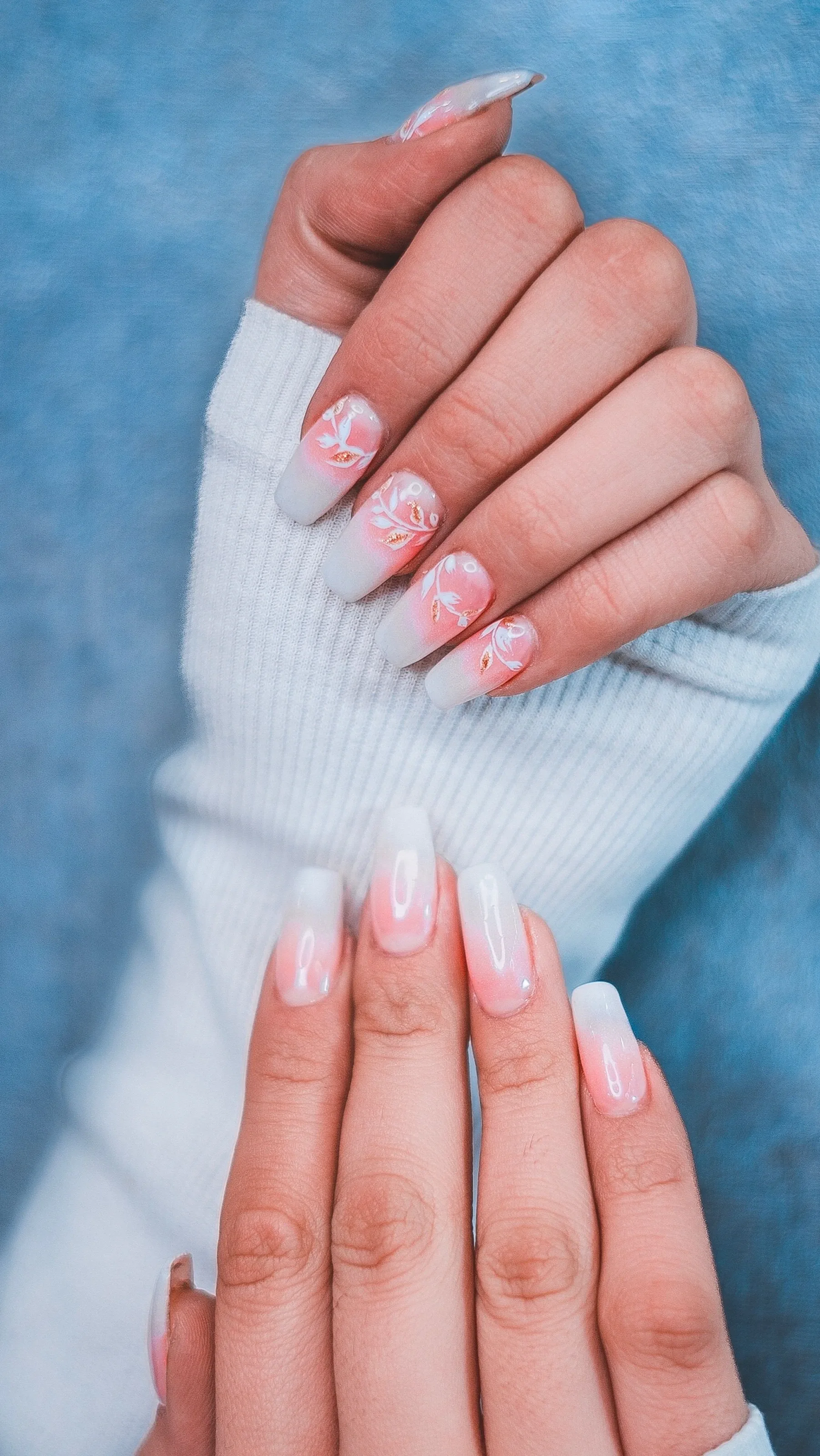 Milky white ombré nails with hand-painted floral nail art